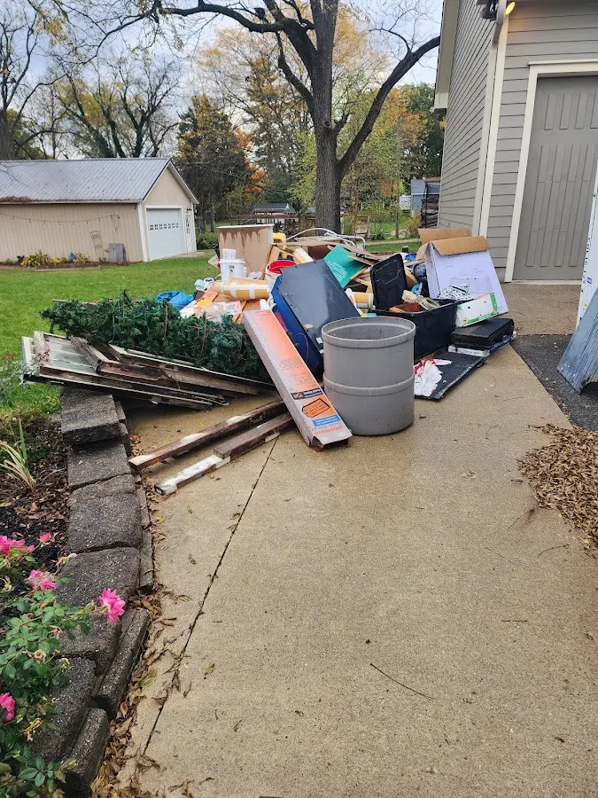 Dumpster being loaded with debris for Estate Cleanout Dumpster Rental in West Penn